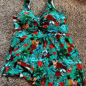 Torrid One-Piece Swimsuit. Size 3- NWOT, never worn. Super cute. Ties on side.